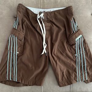 Billabong size 36 brown with blue stripe board shorts. 2 side pockets.